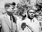 Senator John F. Kennedy and the Kenyan nationalist leader Tom Mboya speak to reporters after their meeting on July 26, 1960, in Hyannis Port, Massachusetts