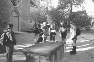 Students ponder the pattern of graves at Bruton Parish Church, Williamsburg, Virginia.