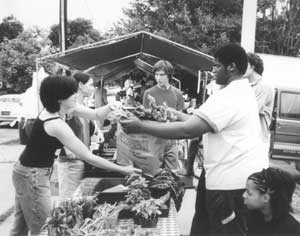 Students from University City High School sell their produce at the Powelton Farmers' Market at Drew Elementary School in West Philadelphia